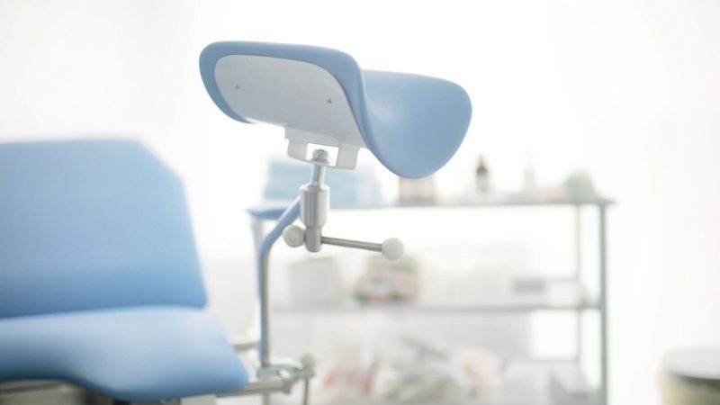 Gynaecological examination chair in a consulting room