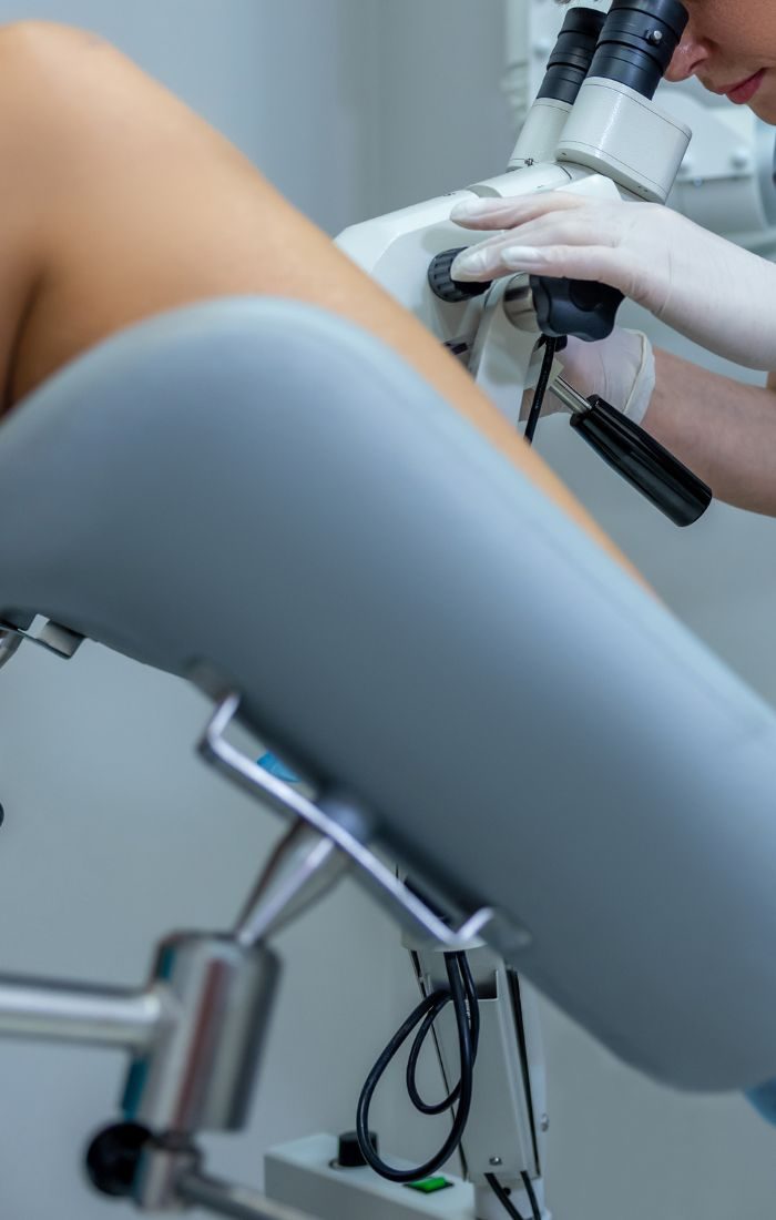 Colposcope pointed towards the examination chair