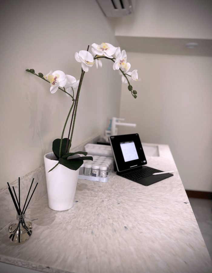 Reception desk with orchid and tablet