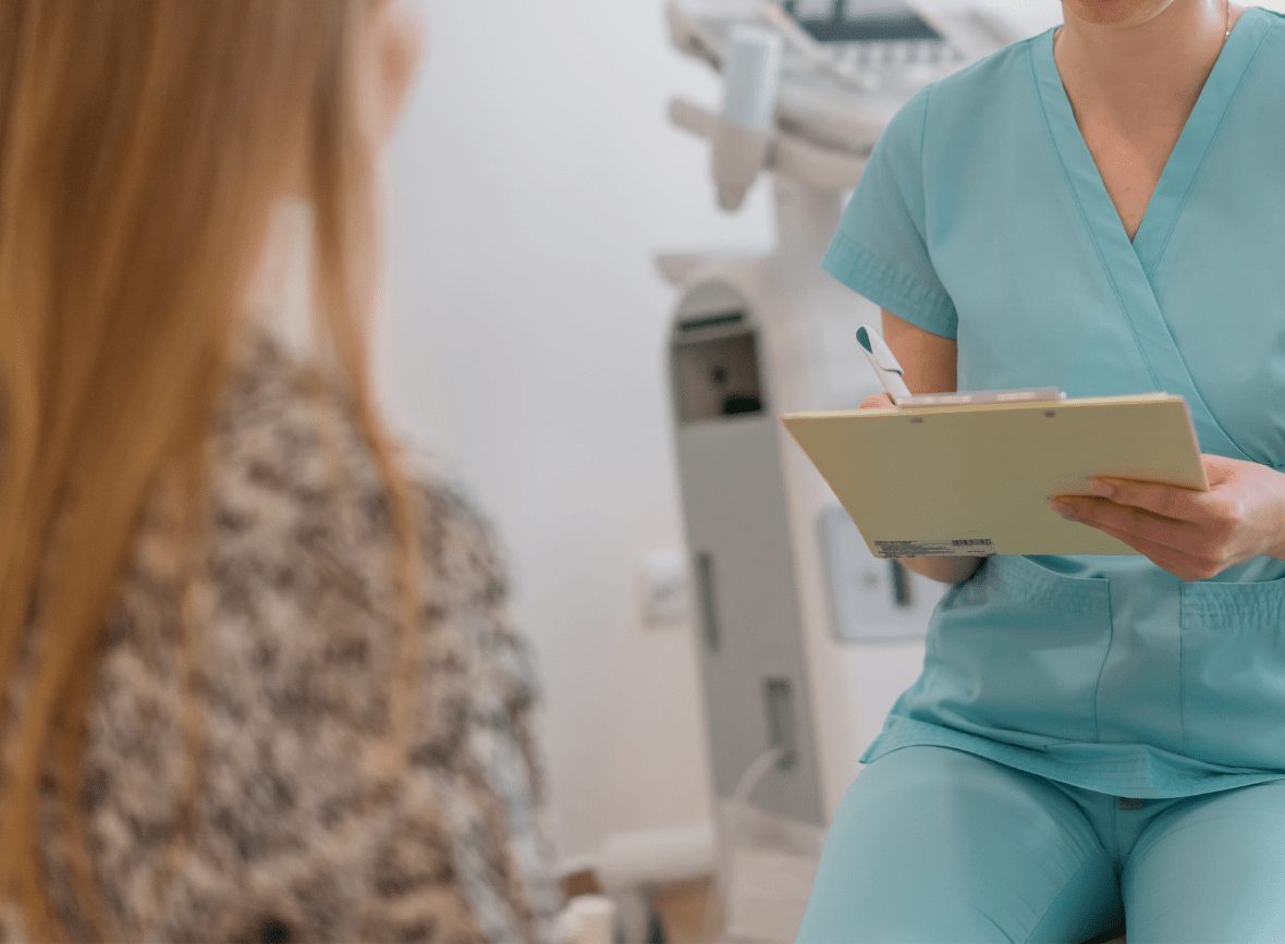 Nurse in consultation with a patient