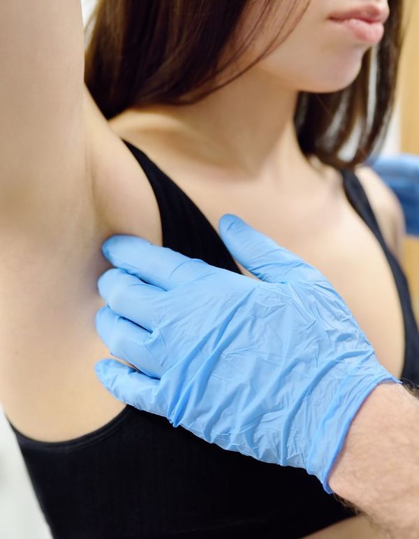 Clinical breast examination by a healthcare professional